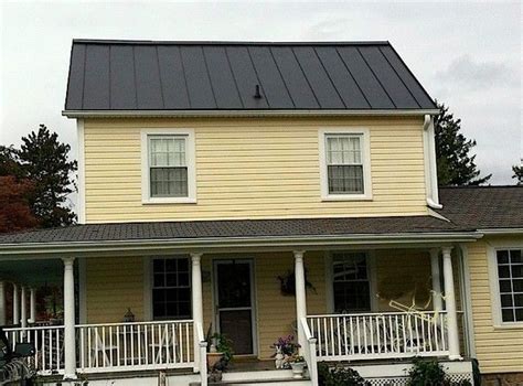 black metal roof on yellow house|pictures of houses painted yellow.